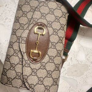 Gucci Beige and Brown Crossbody Bag with Gold Accents
Like new condition